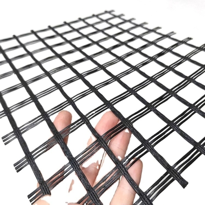 La fibra de vidrio biaxial Geogrid cuenta un cuento la malla de refuerzo resistente del álcali de la reparación del camino de Bitume